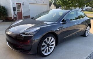 black shiny tesla at Murfreesboro Paint Protection Film and Ceramic Coating