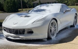 washing a white corvette