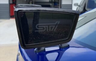 Tail on a blue Subaru